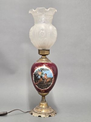 a lamp that is sitting on a table with a picture on it