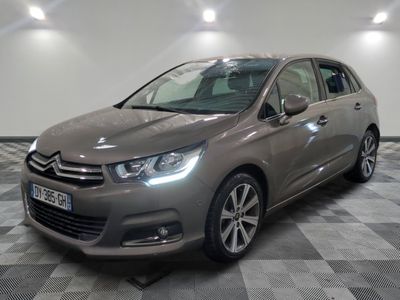 the grey citrole is parked on a checkered tile floor