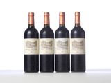three bottles of wine are lined up on a table