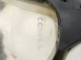 a close up of a motorcycle helmet with a hole in it