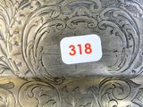 a close up of a silver plate with a number 38 on it