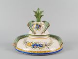 an image of a decorative vase with a pineapple on it