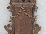 an old wooden door with a rope hanging from it