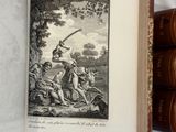 an open book with a picture of a man holding a sword