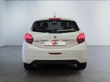 a white car that is parked in a room