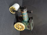 a small toy car that is sitting on a black surface