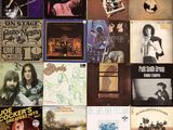 many different album covers on the wall of this room