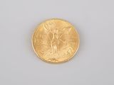 an image of a gold coin sitting on top of a white surface
