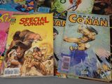 a lot of comic books that are on the table