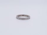 an image of a diamond ring on a white surface