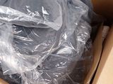 a cardboard box with a plastic bag in it