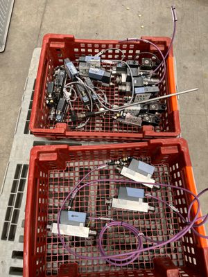 two crates with electronic equipment in them sitting on the ground