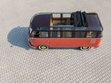 a toy bus that is sitting on the ground