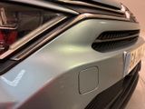 a close up of a car ' s front bumper with a number plate on it