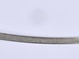 a close up of a knife on a white surface with a white background