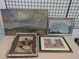 three paintings on a table with a cat on it
