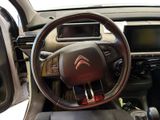 the interior of a car with a steering wheel and dashboard controls