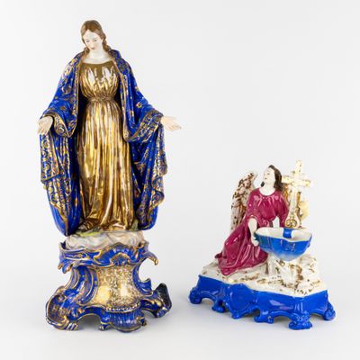 two figurines of the virgin mary and jesus in blue and gold