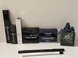 a lot of makeup products on a white table