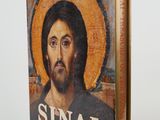 an old book with a picture of jesus on the cover