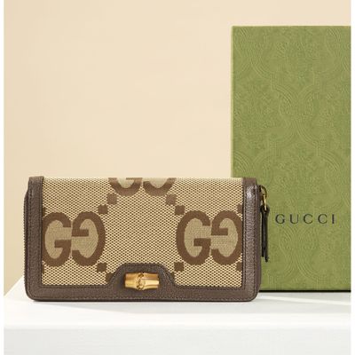GUCCI, Portefeuille en toile tissée beige monogrammée et cui…
