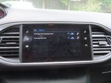 the dashboard of a car with a digital display in the center