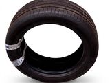 a tire that is sitting on a white surface