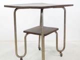 a small table with a small stool on it