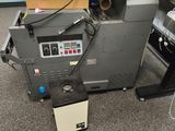 a machine that is sitting on the floor next to a box