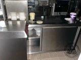 a stainless steel kitchen with a sink and a dishwasher