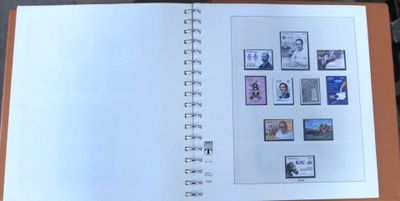 an open book with pictures on it on a table