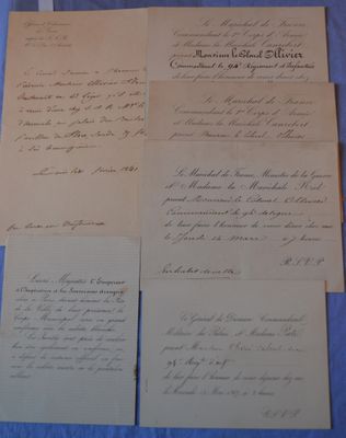 a bunch of old papers sitting on top of a blue table
