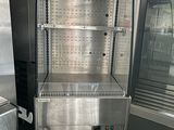 a stainless steel refrigerator and freezer in a kitchen