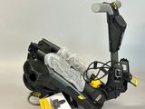 a close up of a scooter with a snowboard attached to it