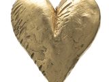a gold heart shaped object on a white background
