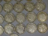 a lot of coins that are sitting on a table