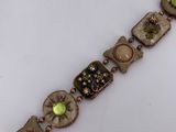 an image of a close up of a bracelet on a white surface