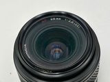 a close up of a camera lens on a white surface