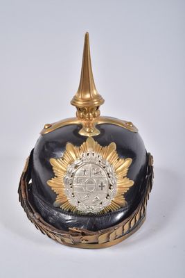 an image of a black and gold helmet with a gold crown on top