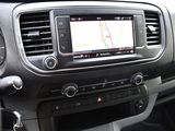 the dashboard of a car with a gps device in the center