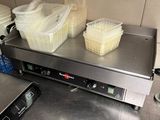 several containers of food sit on top of a counter in a kitchen