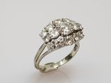 an 18k white gold diamond cluster ring