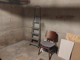 a room with a ladder, a chair, and a chair in it