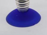 a blue glass vase with a small flower inside of it