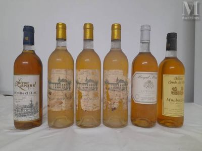 six bottles of wine are lined up on a table
