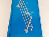 a blue box with a silver handle on a white table