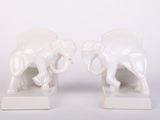 pair of white elephant bookends on a white background