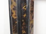 an image of a picture frame with a brown and black design