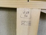 une photo d'un morceau de bois sur lequel est accrochée une étiquette de prix