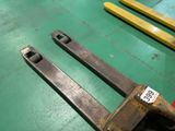 two large wrenes sitting on a green floor